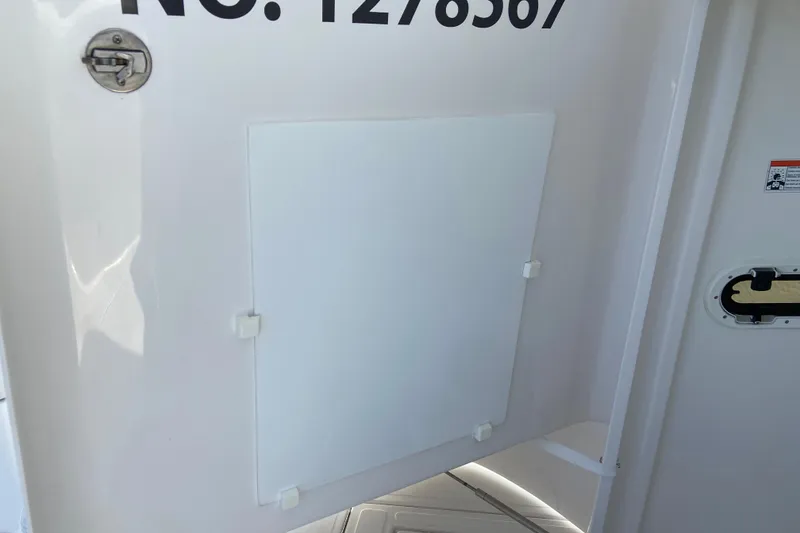Slide: The Image of 2017 Stamas 317 Tarpon boat detail with registration number and hatch. - 38