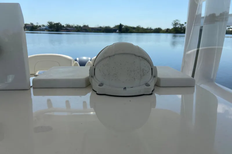 Slide: The Image of 2017 Stamas 317 Tarpon boat detail with serene water backdrop. - 44