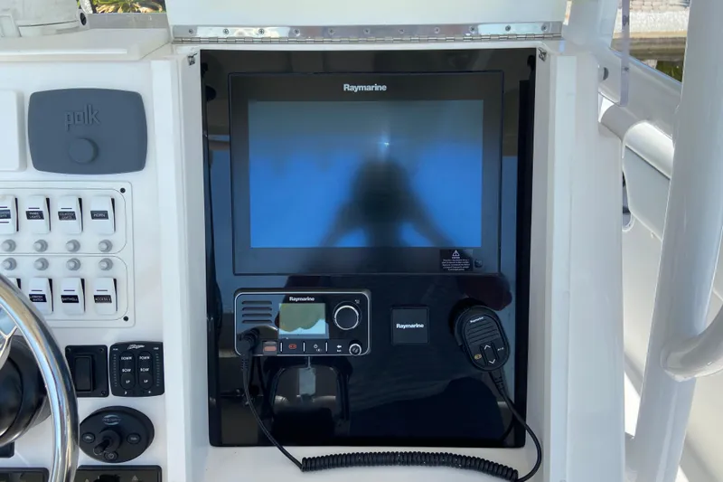 Slide: The Image of Control panel of a 2017 Stamas 317 Tarpon boat featuring Raymarine electronics. - 40