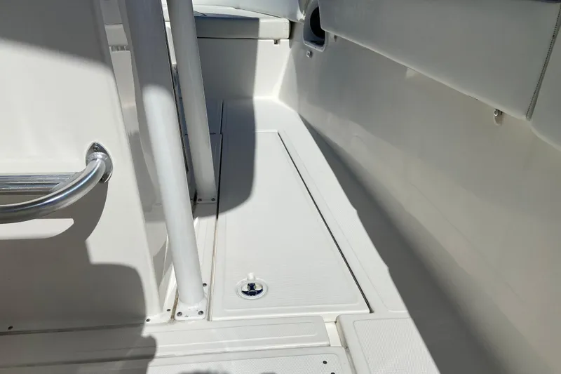 Slide: The Image of 2017 Stamas 317 Tarpon boat interior with sleek white deck and stainless steel railing. - 33