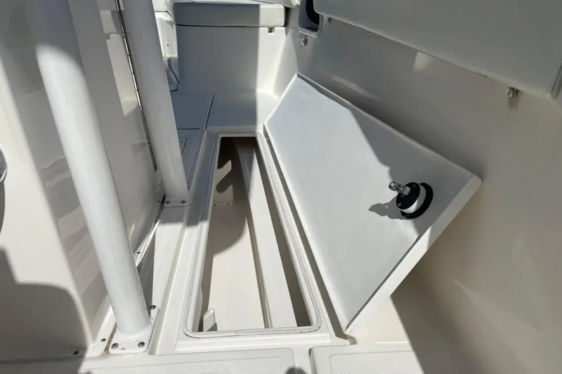 Slide: The Image of Open storage compartment on a 2017 Stamas 317 Tarpon boat, showcasing interior space. - 34