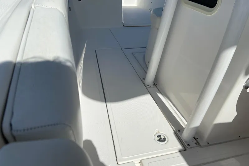 Slide: The Image of Interior view of a 2017 Stamas 317 Tarpon boat, showcasing seating and deck details. - 31