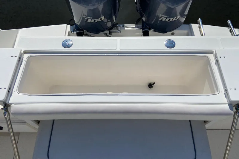Slide: The Image of 2017 Stamas 317 Tarpon boat with Yamaha 300 engines and open storage compartment. - 15