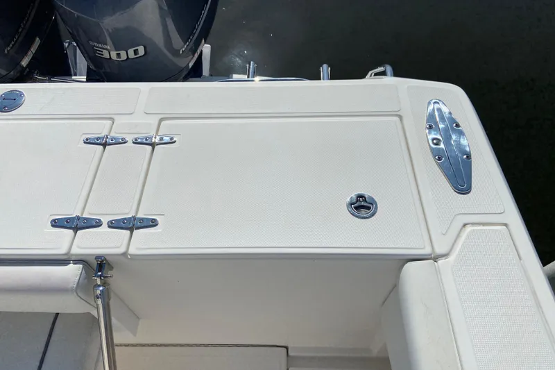Slide: The Image of 2017 Stamas 317 Tarpon boat deck with Yamaha 300 engines, featuring sleek design and hardware. - 16