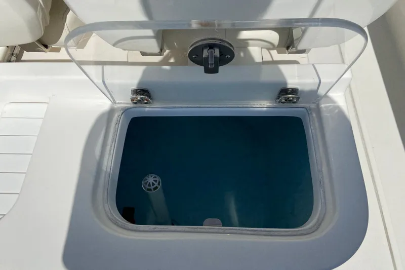 Slide: The Image of Livewell compartment on a 2017 Stamas 317 Tarpon boat, open with clear lid. - 27
