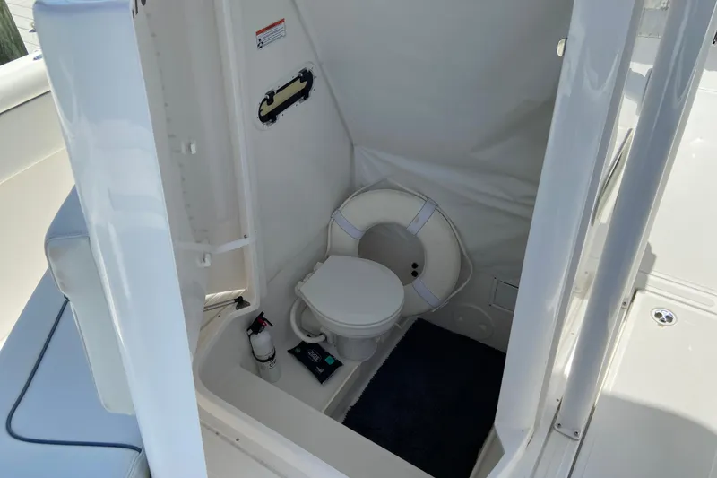 Slide: The Image of 2017 Stamas 317 Tarpon boat interior with compact marine toilet. - 57