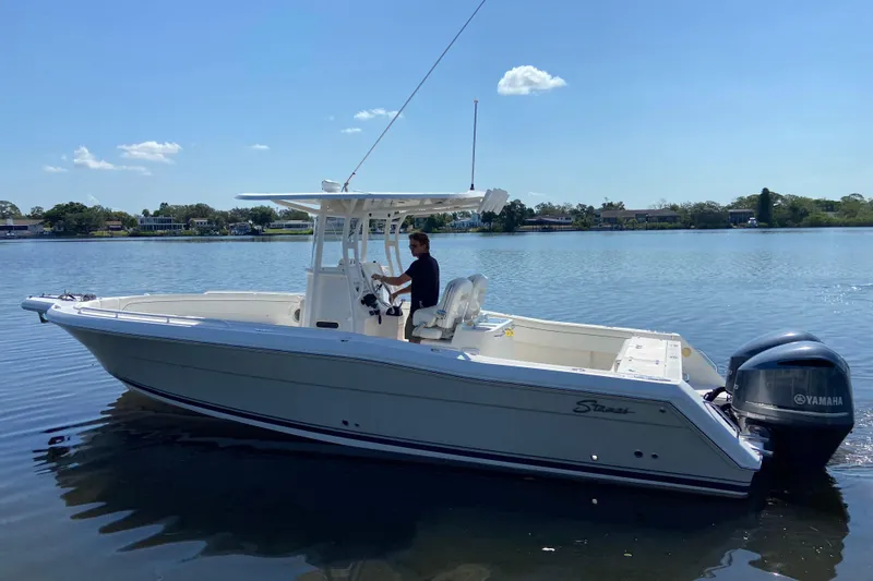 Slide: The Image of 2017 Stamas 317 Tarpon boat on calm water with Yamaha engine. - 2