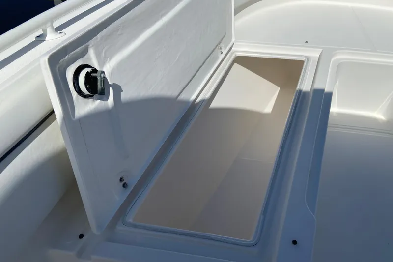 Slide: The Image of Open storage compartment on a 2017 Stamas 317 Tarpon boat. - 64