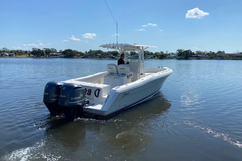 Slide: The Image of 2017 Stamas 317 Tarpon boat with dual Yamaha engines on a calm lake. - 5