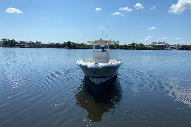 Slide: The Image of 2017 Stamas 317 Tarpon boat on calm lake under clear blue sky. - 10