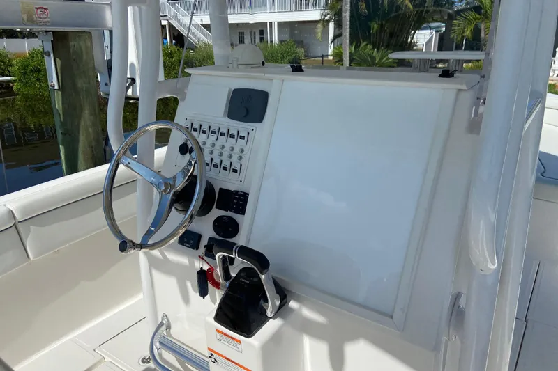 Slide: The Image of 2017 Stamas 317 Tarpon boat helm with steering wheel and control panel. - 37
