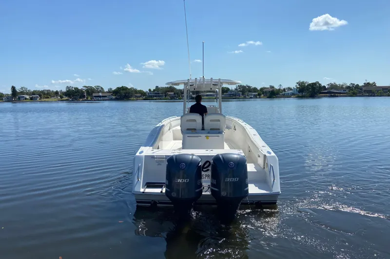 Slide: The Image of 2017 Stamas 317 Tarpon boat with dual engines on a calm lake. - 4