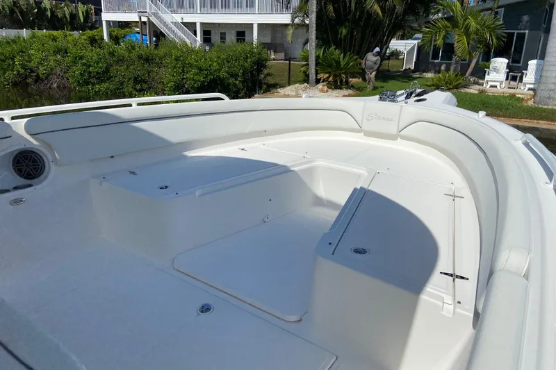 Slide: The Image of 2017 Stamas 317 Tarpon boat interior with spacious seating and storage compartments. - 45