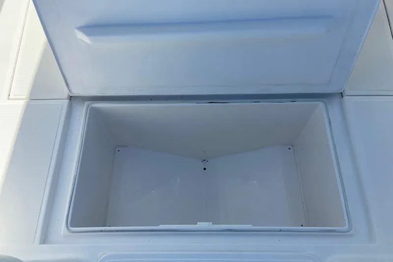 Slide: The Image of Open storage compartment on a 2017 Stamas 317 Tarpon boat. - 55