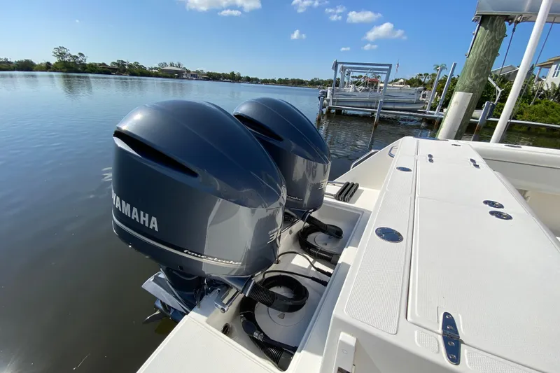 Slide: The Image of 2017 Stamas 317 Tarpon boat with twin Yamaha outboard engines on a calm waterway. - 11