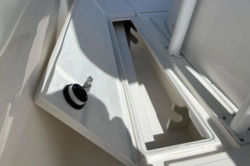 Slide: The Image of Open storage compartment on a 2017 Stamas 317 Tarpon boat, showcasing interior space. - 32
