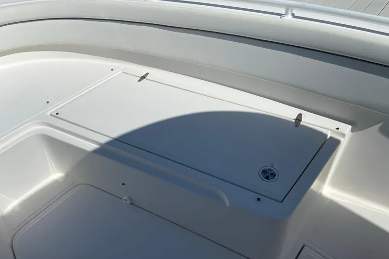 Slide: The Image of 2017 Stamas 317 Tarpon boat deck with storage compartment and latch. - 61