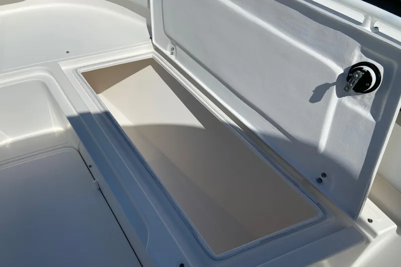 Slide: The Image of Open storage compartment on a 2017 Stamas 317 Tarpon boat. - 62