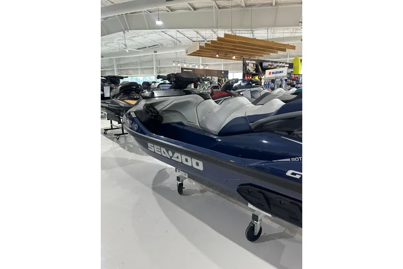 Slide: The Image of 2023 Sea-Doo GTX 230 jet ski displayed in a showroom. - 12