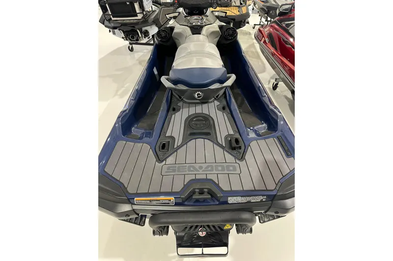Slide: The Image of 2023 Sea-Doo GTX 230 jet ski, blue and gray, rear view in showroom. - 5