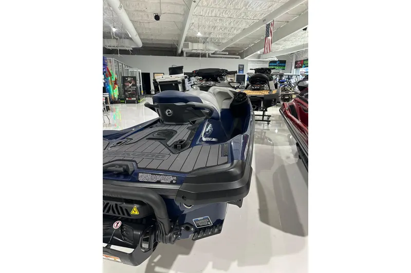 Slide: The Image of 2023 Sea-Doo GTX 230 jet ski displayed in a showroom. - 6
