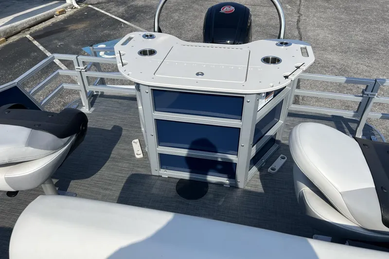 Slide: The Image of 2024 Lowe SF 214 Sport Fish boat interior with seating and control panel. - 3
