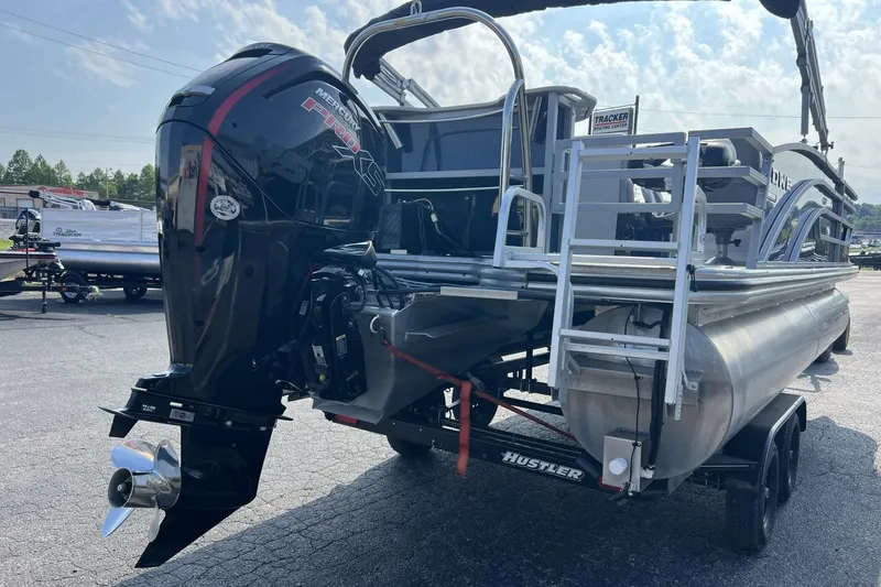 Slide: The Image of 2024 Lowe SF 214 Sport Fish pontoon boat with powerful Mercury Pro XS outboard engine. - 2
