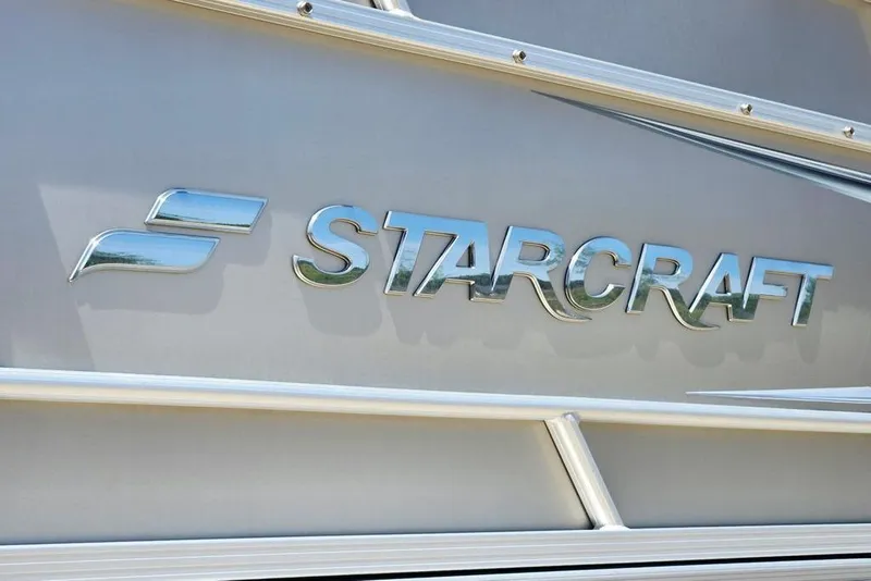 Slide: The Image of Chrome "Starcraft" logo on 2019 Starcraft EX 20 C boat exterior. - 16