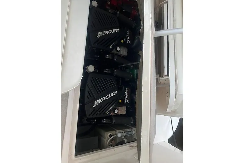Slide: The Image of Engine compartment of a 2001 Sea Ray 340 Sundancer with Mercury engines. - 23