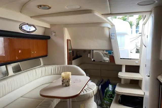 Slide: The Image of Luxurious interior of 2001 Sea Ray 340 Sundancer yacht with plush seating and elegant decor. - 7