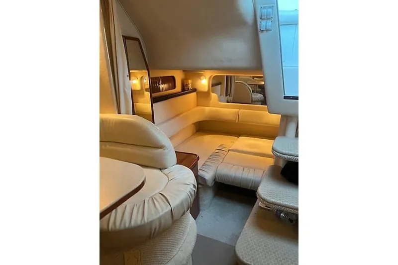 Slide: The Image of Luxurious interior of 2001 Sea Ray 340 Sundancer yacht with cozy seating and ambient lighting. - 8