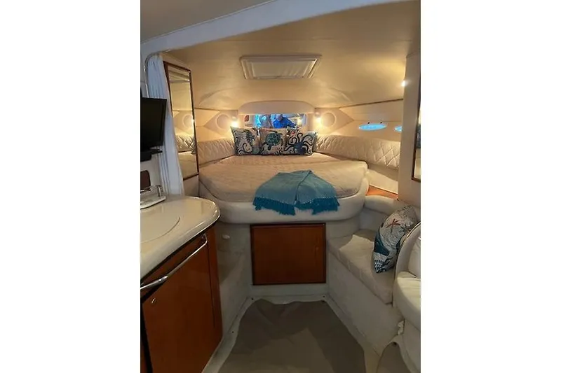 Slide: The Image of Interior of 2001 Sea Ray 340 Sundancer yacht with cozy bed and elegant decor. - 18