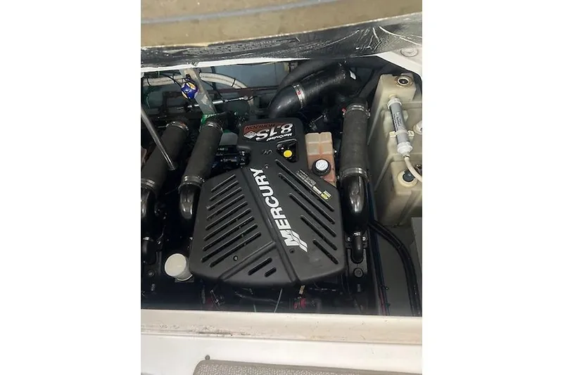Slide: The Image of Engine compartment of a 2001 Sea Ray 340 Sundancer with Mercury components. - 22