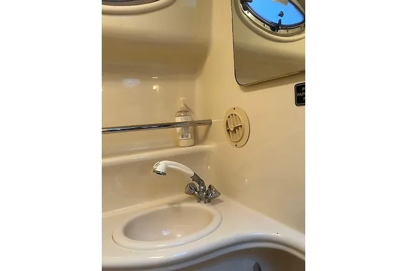 Slide: The Image of Bathroom sink area in a 2001 Sea Ray 340 Sundancer yacht. - 19