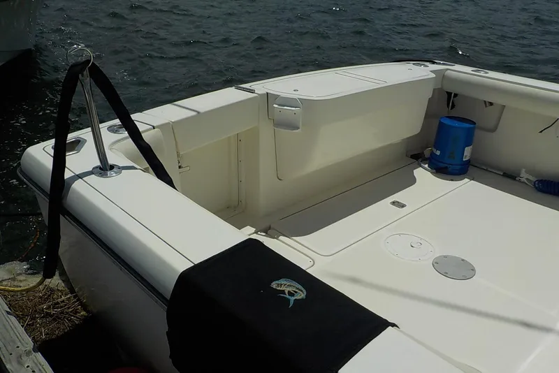 Slide: The Image of 1996 Pursuit 3000 Offshore boat deck with fishing gear and ocean view. - 4