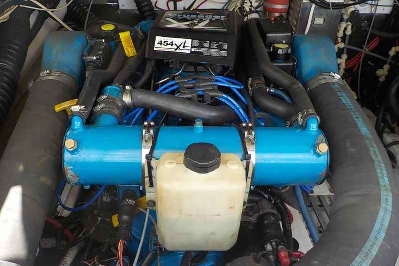 Slide: The Image of Engine of a 1996 Pursuit 3000 Offshore boat, featuring a 454XL model. - 23