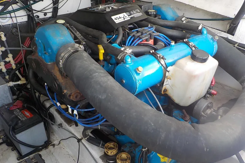 Slide: The Image of Engine compartment of a 1996 Pursuit 3000 Offshore boat, featuring a 454 X4 engine. - 19