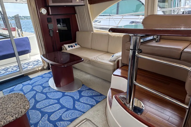 Slide: The Image of Luxurious interior of a 2006 Sea Ray 44 Sedan Bridge yacht with elegant seating and decor. - 23