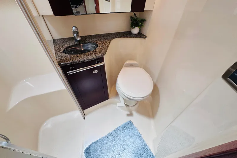 Slide: The Image of Luxurious bathroom in 2006 Sea Ray 44 Sedan Bridge yacht with granite countertop. - 13