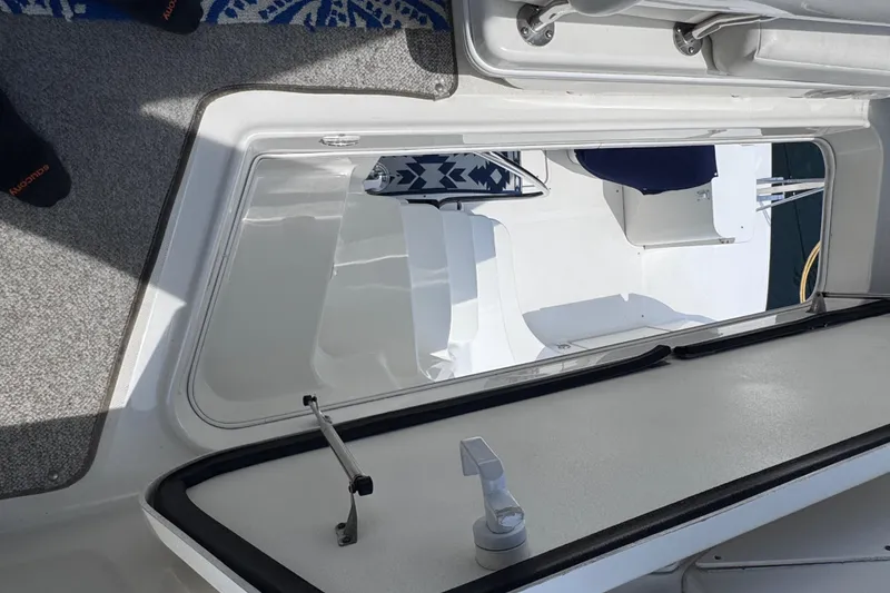 Slide: The Image of 2006 Sea Ray 44 Sedan Bridge interior view with seating and deck details. - 37