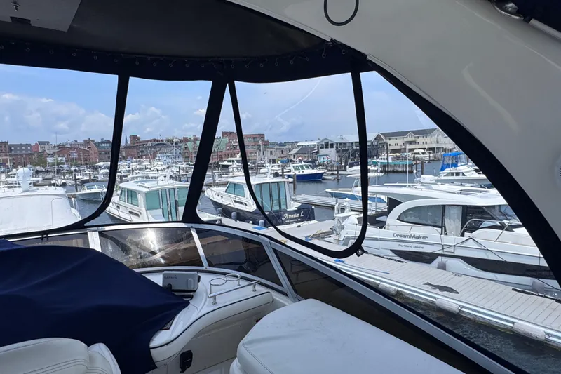Slide: The Image of View from 2006 Sea Ray 44 Sedan Bridge overlooking marina with multiple boats docked. - 31