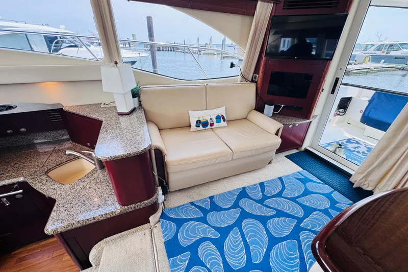 Slide: The Image of Luxurious interior of 2006 Sea Ray 44 Sedan Bridge yacht with elegant seating and decor. - 20