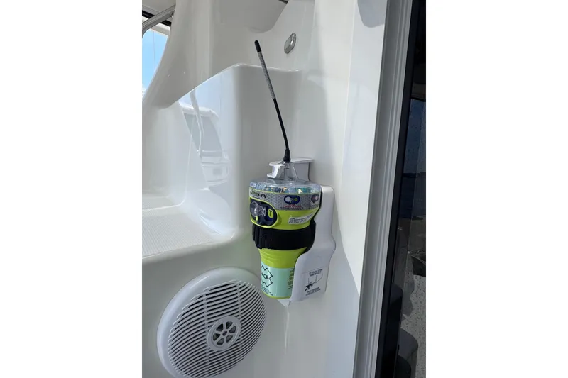 Slide: The Image of Emergency radio device on 2006 Sea Ray 44 Sedan Bridge yacht, mounted near speaker. - 39