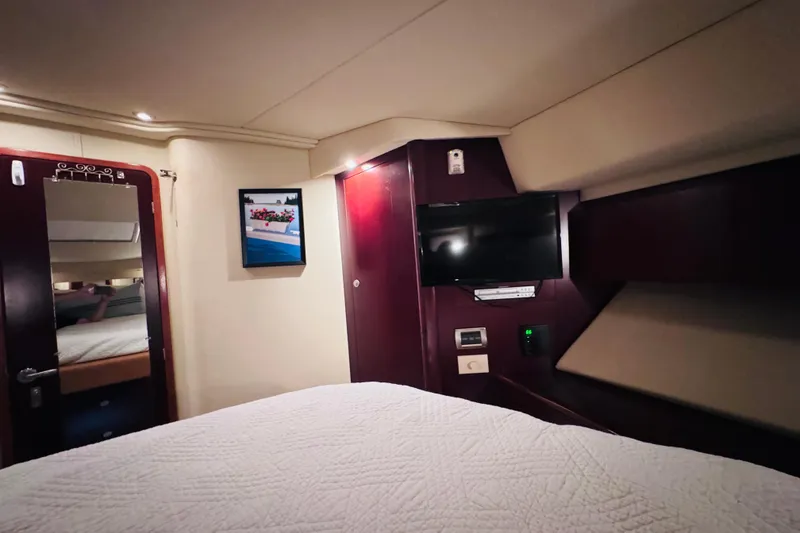 Slide: The Image of Interior cabin of 2006 Sea Ray 44 Sedan Bridge with TV and mirror. - 5
