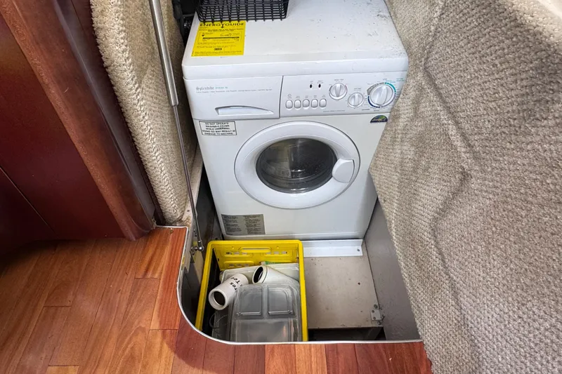 Slide: The Image of Compact washing machine in a 2006 Sea Ray 44 Sedan Bridge yacht interior. - 38