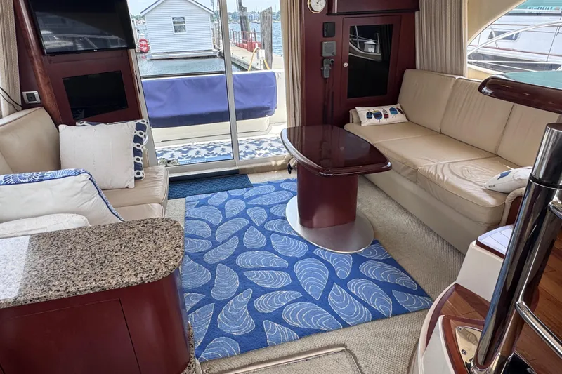 Slide: The Image of Luxurious interior of a 2006 Sea Ray 44 Sedan Bridge yacht with elegant seating and decor. - 22