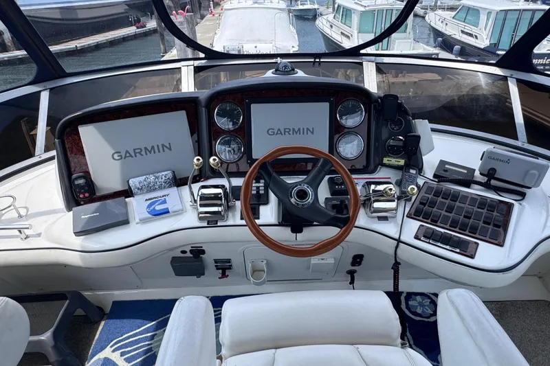Slide: The Image of Cockpit of 2006 Sea Ray 44 Sedan Bridge with Garmin navigation systems and controls. - 29