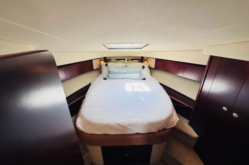 Slide: The Image of Luxurious bedroom interior of 2006 Sea Ray 44 Sedan Bridge yacht with skylight. - 4