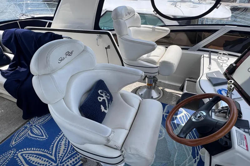 Slide: The Image of Luxurious 2006 Sea Ray 44 Sedan Bridge helm with plush seating and nautical decor. - 33