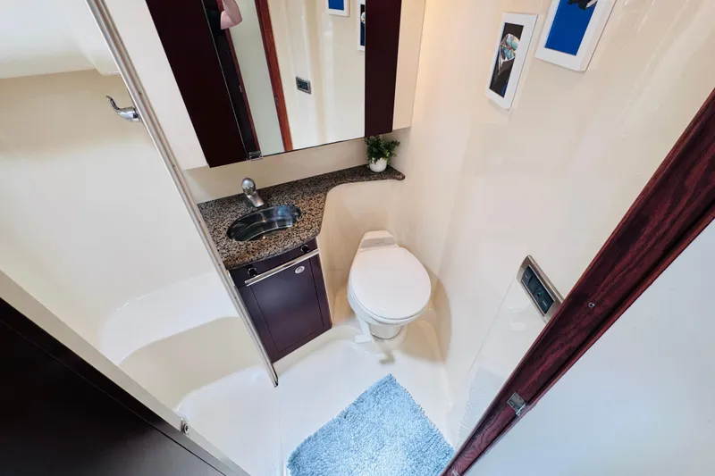 Slide: The Image of Luxurious bathroom in 2006 Sea Ray 44 Sedan Bridge yacht with modern fixtures and decor. - 9